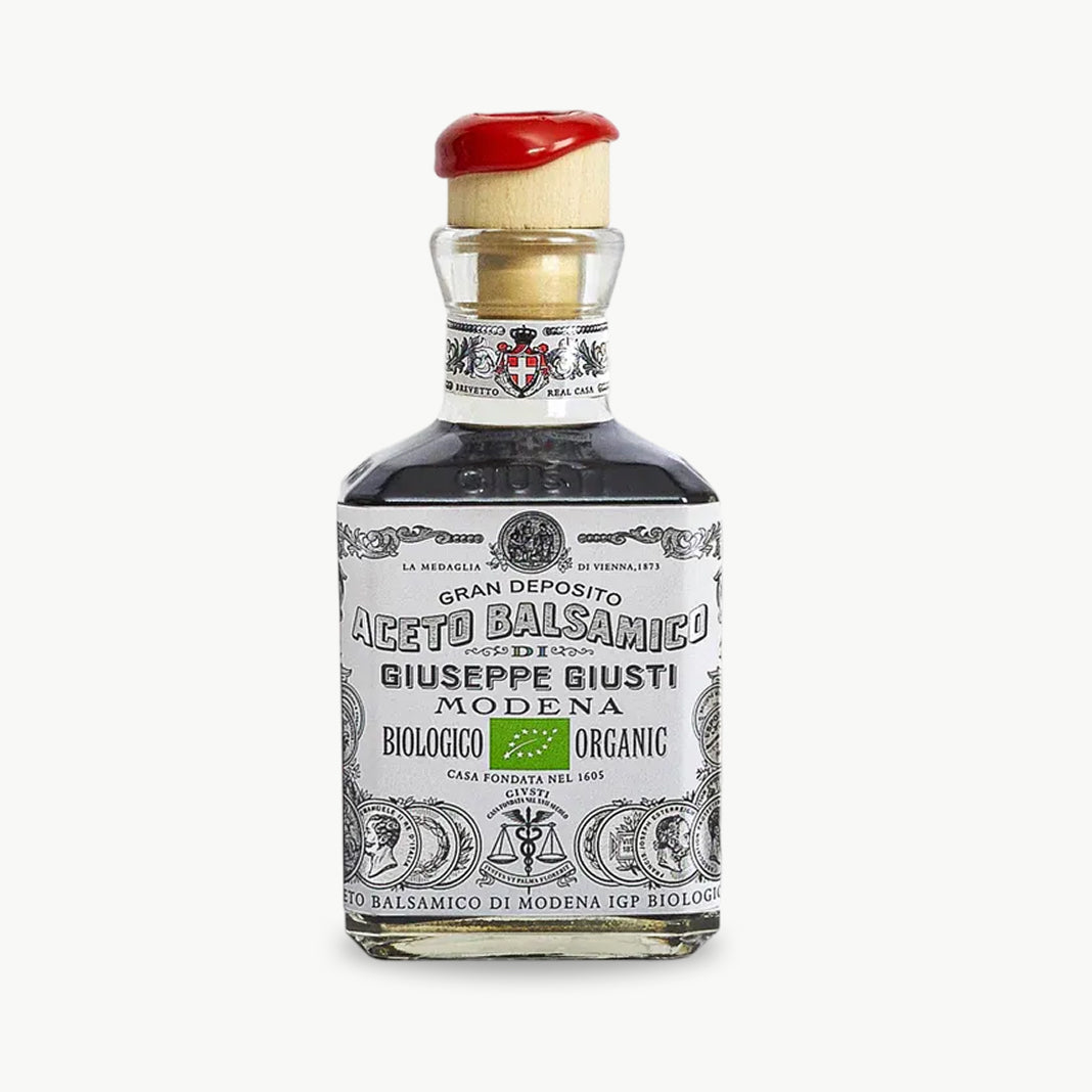 Organic balsamic vinegar of Modena in glass bottle
