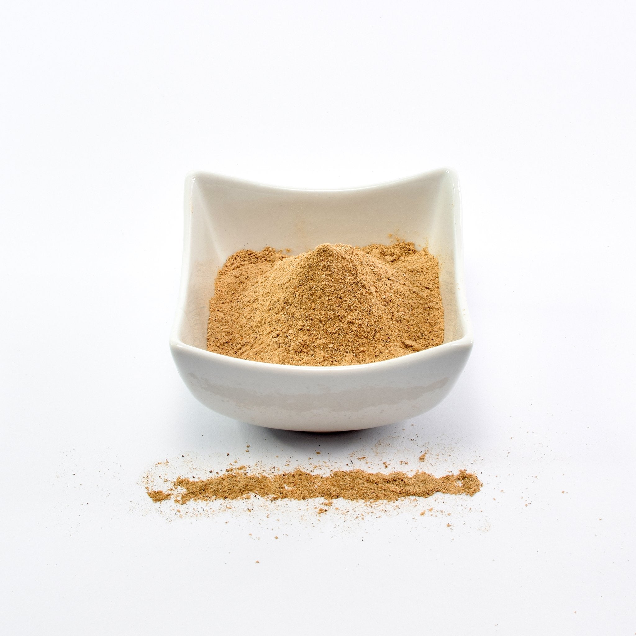 Organic Chanterelle Powder on the table in a small bowl - The Bio Foods