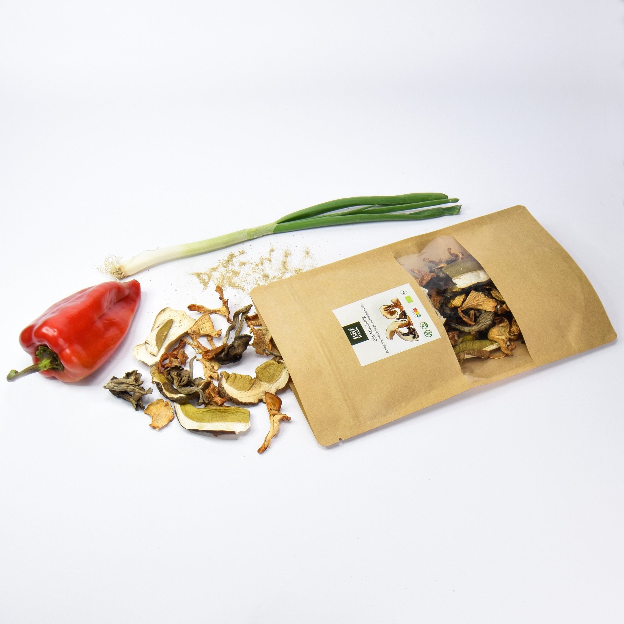 Organic Dried Mixed Wild Mushrooms - made of 3 different types of mushrooms. Organic porcini, black trumpet and chanterelles pieces of mushrooms on the table. The Bio Foods