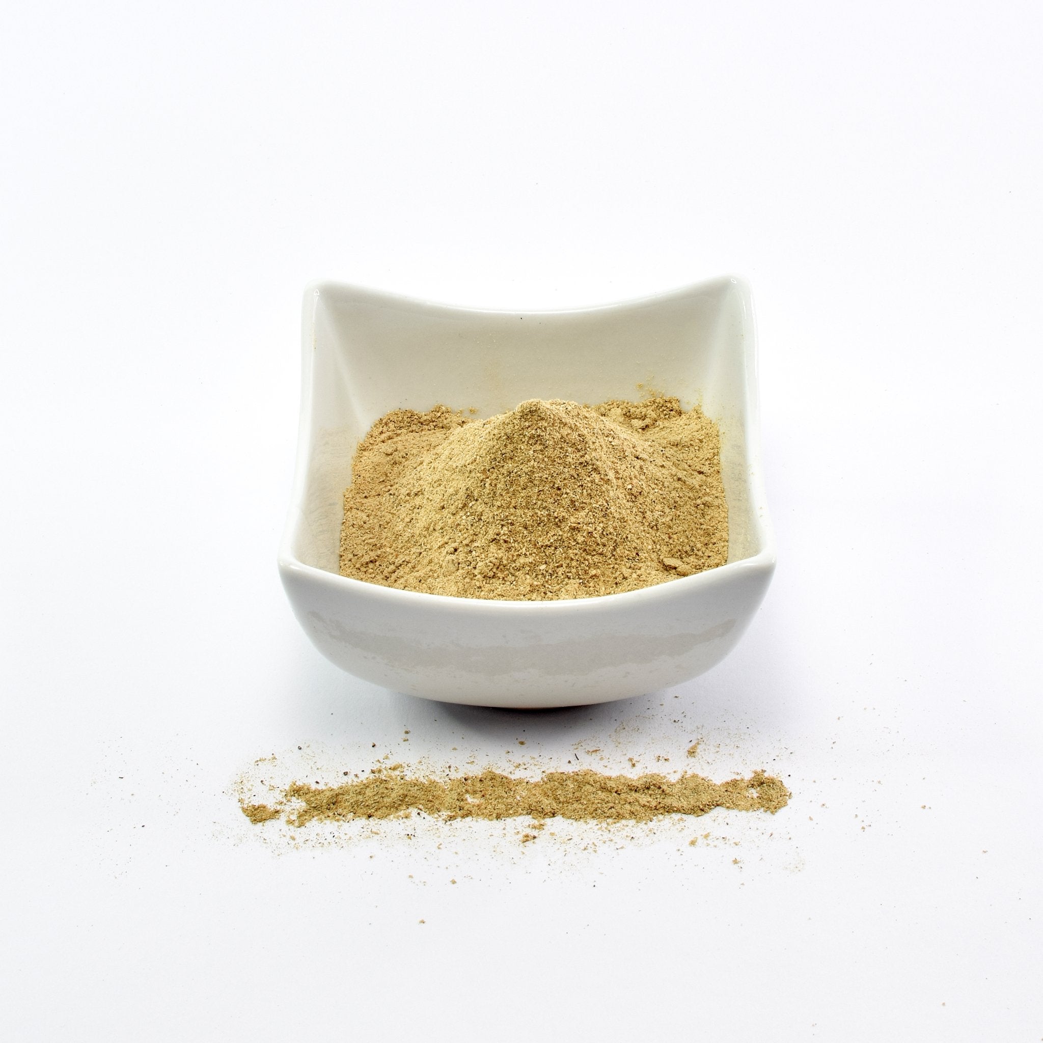 Organic Porcini Powder on the table. Grounded organic porcini mushrooms - The Bio Foods