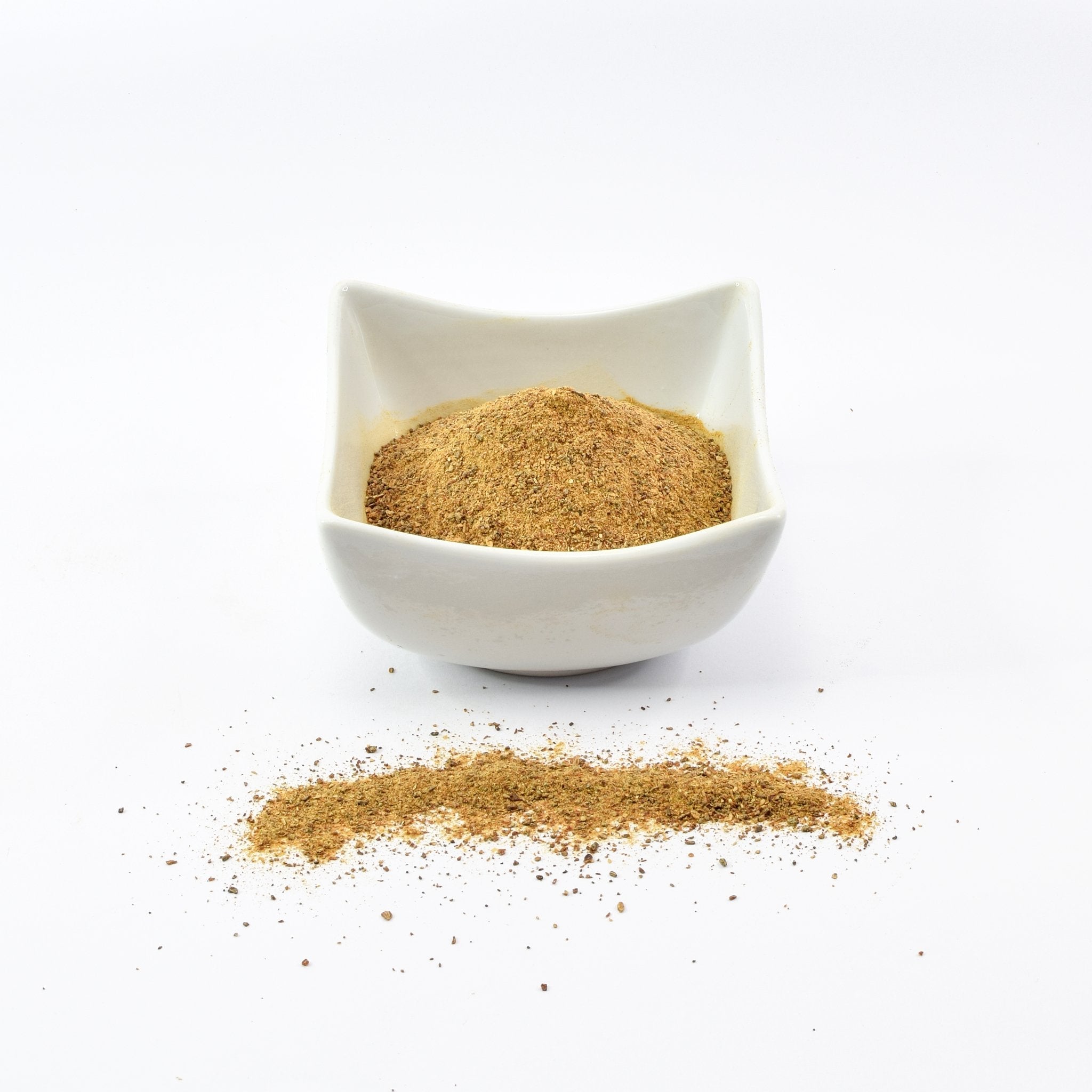 Organic Wild Mushrooms Mix Powder - made from 3 mushroom types in a white bowl on the table.