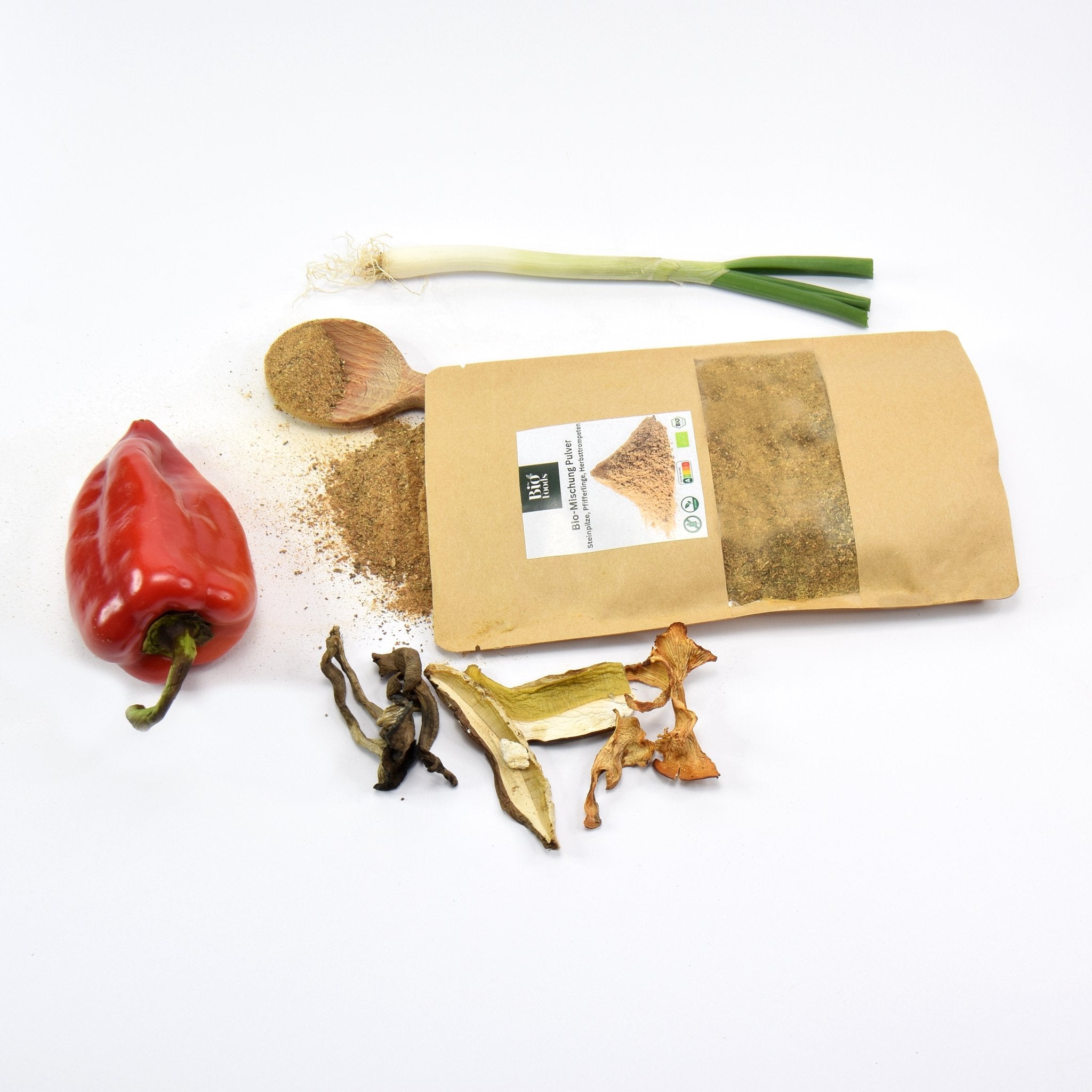 Organic Wild Mushrooms Mix Powder - and 3 types of mushrooms next to the package - Porcini, Chanterelles and Black Trumpet.